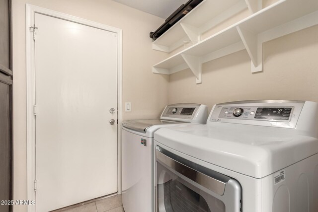 4834 E Robin Ln, Phoenix, AZ 85054 - laundry room with washing machine and dryer and light tile patterned floors