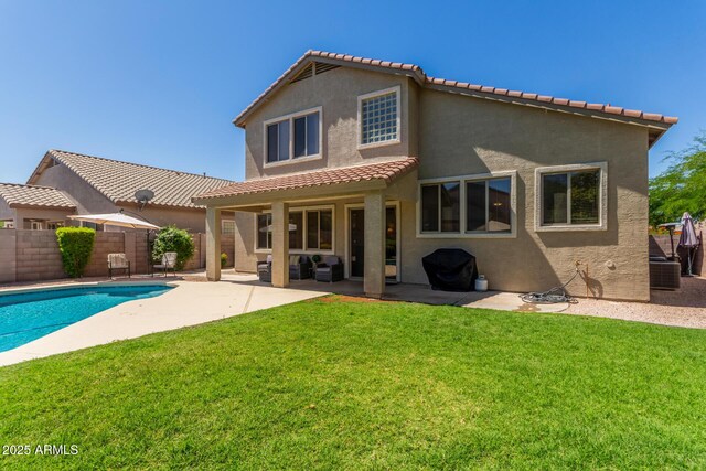 4834 E Robin Ln, Phoenix, AZ 85054 - rear view of property featuring stucco siding, a tile roof, a patio area, and an outdoor living space