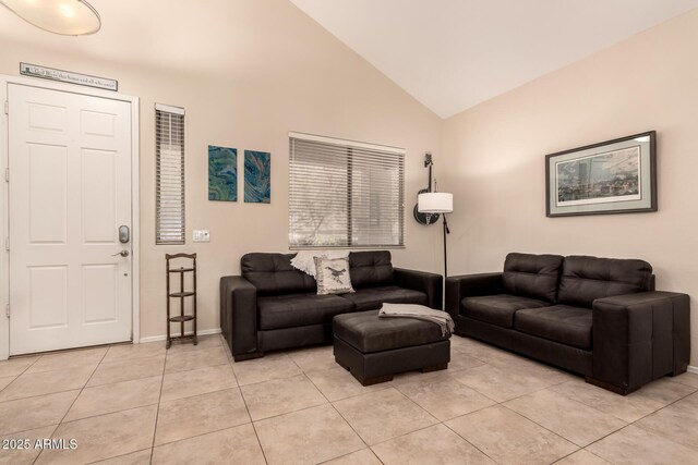 4834 E Robin Ln, Phoenix, AZ 85054 - living room with vaulted ceiling, light tile patterned floors, and baseboards