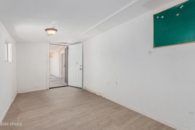 empty room featuring wood-type flooring