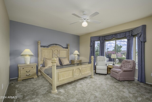 bedroom with ceiling fan and light colored carpet