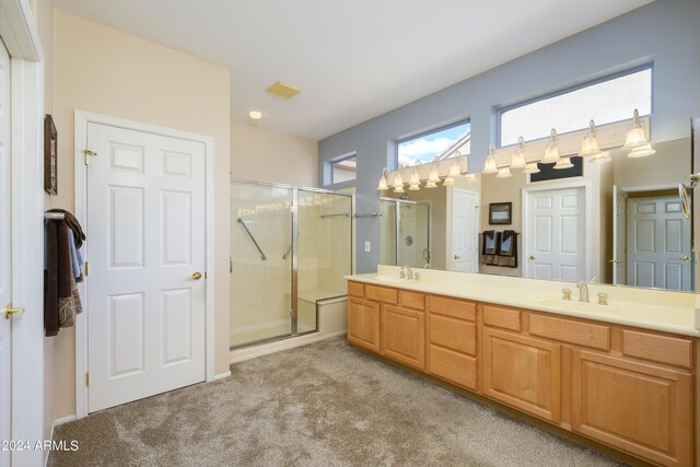 bathroom with an enclosed shower and vanity