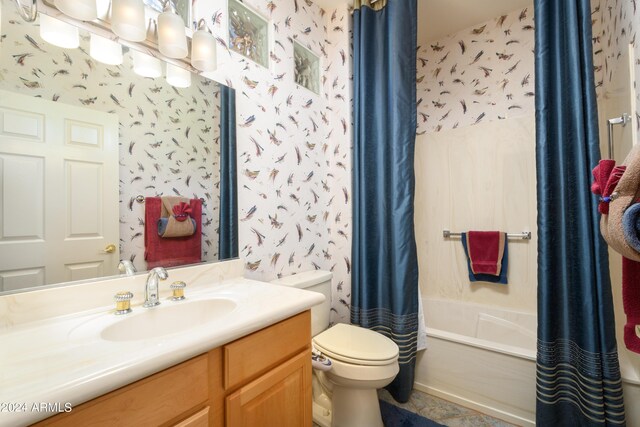 full bathroom featuring shower / bath combo, vanity, and toilet