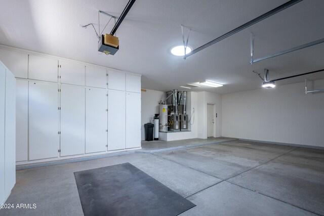 garage with gas water heater and a garage door opener