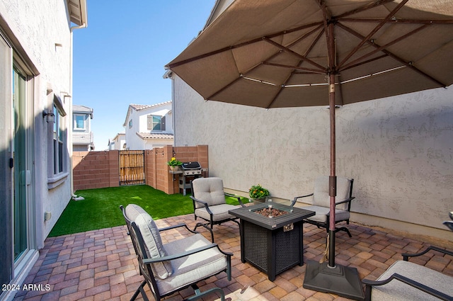 view of patio / terrace featuring a fire pit