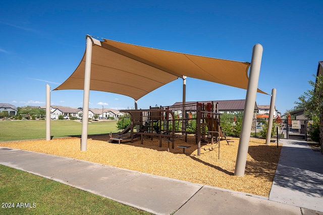 view of playground with a lawn