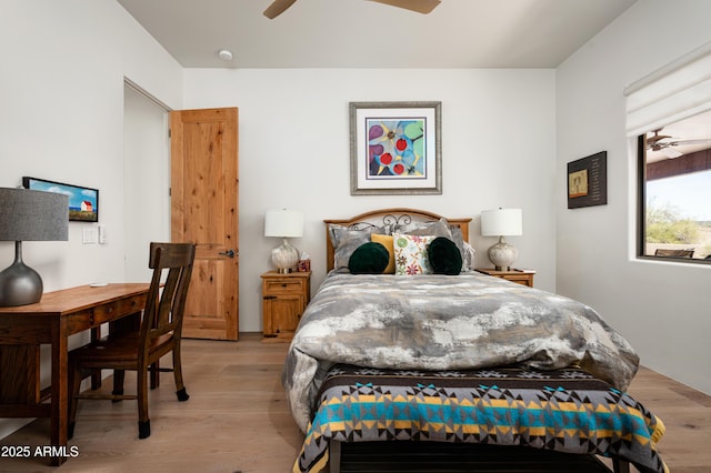 8400 E Dixileta Dr Unit 153, Scottsdale, AZ 85266 - bedroom with a ceiling fan and light wood-style flooring