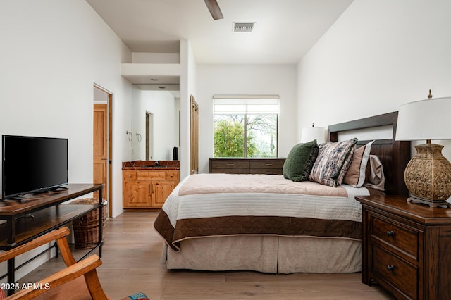 8400 E Dixileta Dr Unit 153, Scottsdale, AZ 85266 - bedroom with ceiling fan, visible vents, and wood finished floors