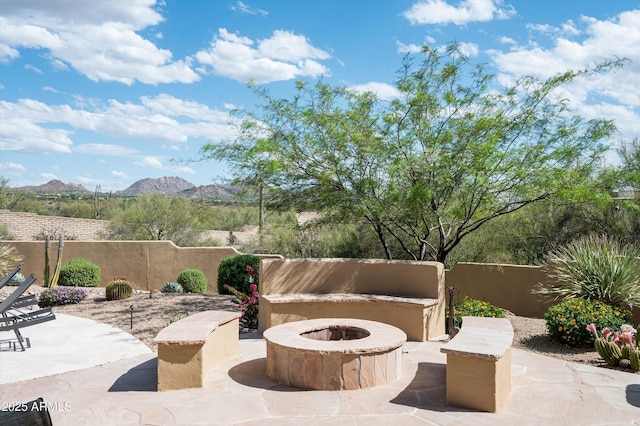 8400 E Dixileta Dr Unit 153, Scottsdale, AZ 85266 - view of patio / terrace featuring fence, a fire pit, and a mountain view