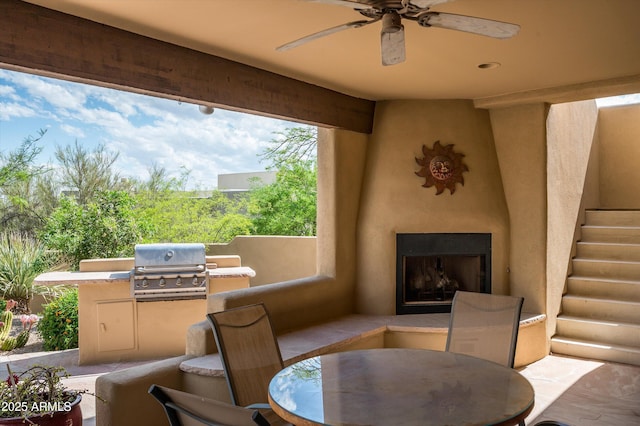 8400 E Dixileta Dr Unit 153, Scottsdale, AZ 85266 - view of patio / terrace featuring an outdoor fireplace, ceiling fan, a grill, exterior kitchen, and outdoor dining space