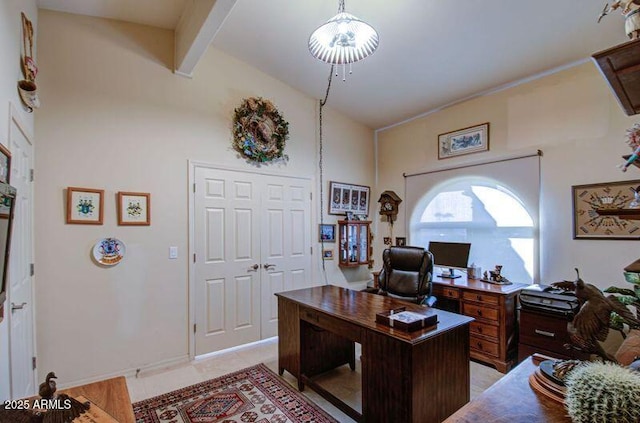 office featuring lofted ceiling with beams