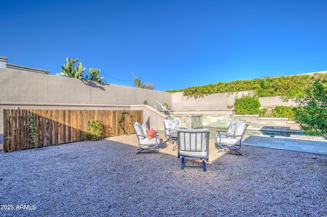 view of yard featuring a fenced backyard and a patio area
