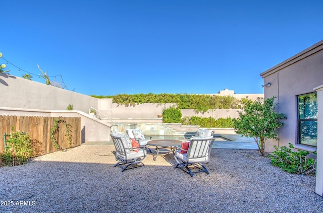 view of yard with outdoor dining area, a fenced backyard, and a patio area