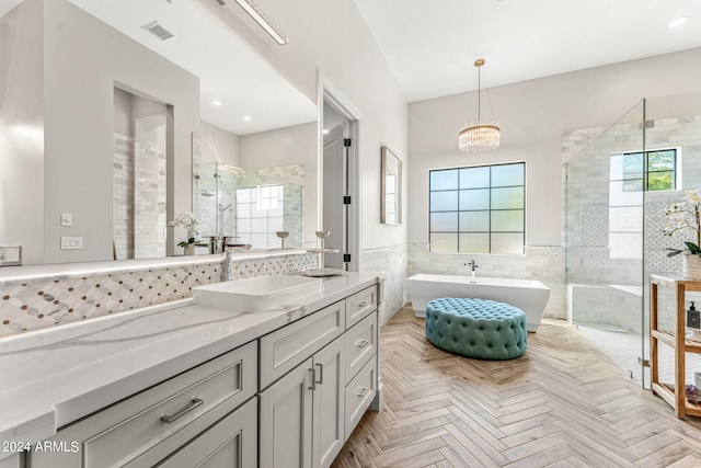 bathroom featuring vanity, separate shower and tub, parquet floors, a chandelier, and tile walls