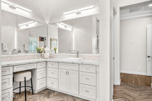 bathroom with vanity and parquet flooring