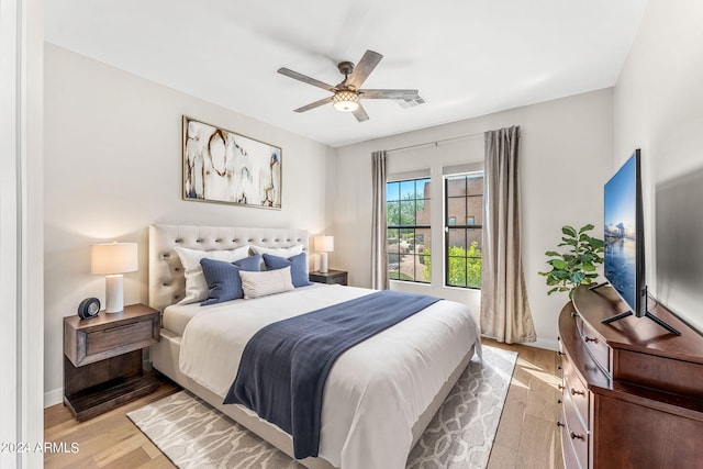 8742 E Villa Cassandra Dr, Scottsdale, AZ 85266 - bedroom with a ceiling fan, baseboards, light wood-type flooring, and visible vents