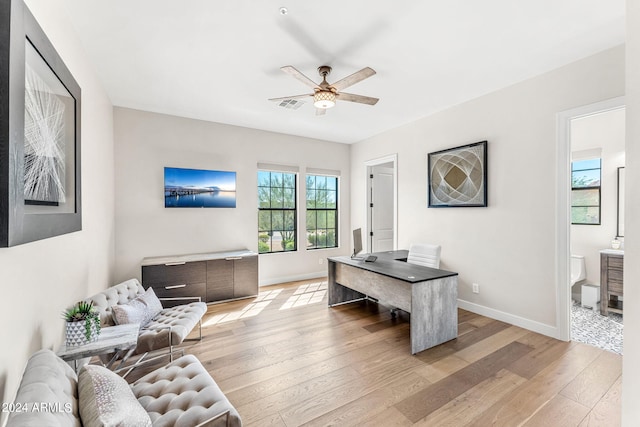 home office featuring ceiling fan and light wood-type flooring