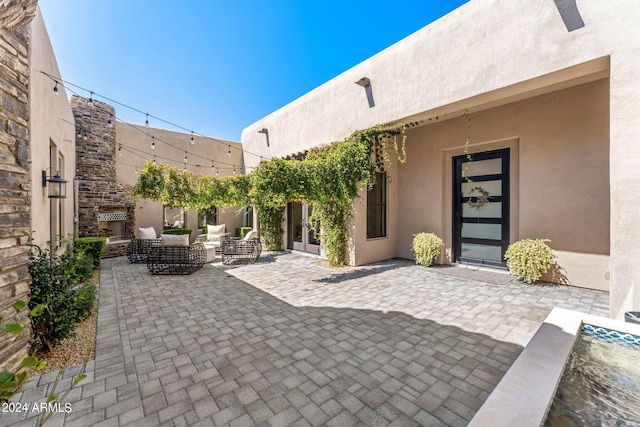 8742 E Villa Cassandra Dr, Scottsdale, AZ 85266 - view of patio / terrace featuring an outdoor hangout area and french doors