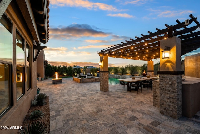 patio terrace at dusk with a pergola