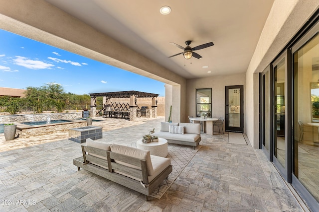 view of patio with outdoor lounge area, a pool with hot tub, and ceiling fan