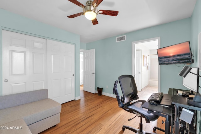 office space featuring ceiling fan and light wood-type flooring