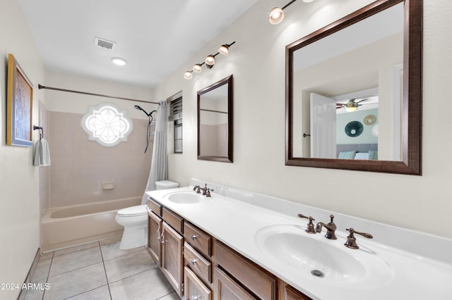 full bathroom featuring tile patterned flooring, vanity, toilet, and shower / bathtub combination with curtain