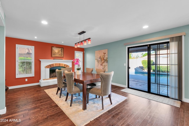 dining area featuring plenty of natural light and dark wood-type flooring