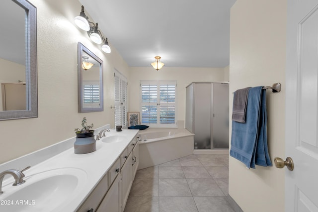 bathroom with tile patterned floors, vanity, and independent shower and bath