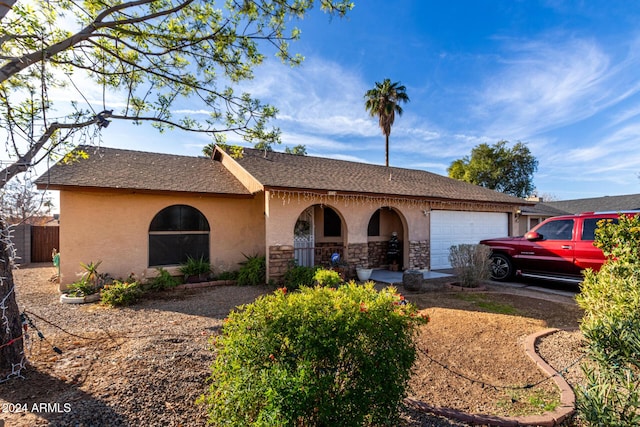 ranch-style home with a garage