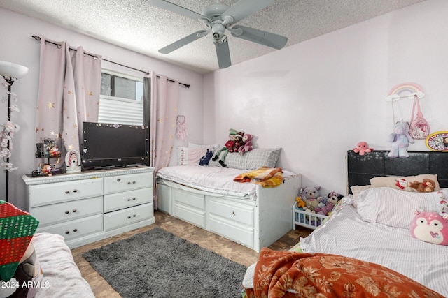 bedroom featuring a textured ceiling and ceiling fan