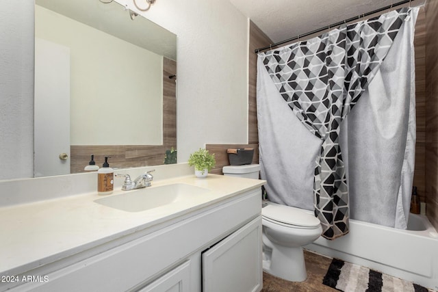 full bathroom featuring vanity, a textured ceiling, toilet, and shower / bathtub combination with curtain