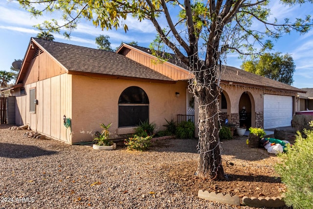 single story home featuring a garage