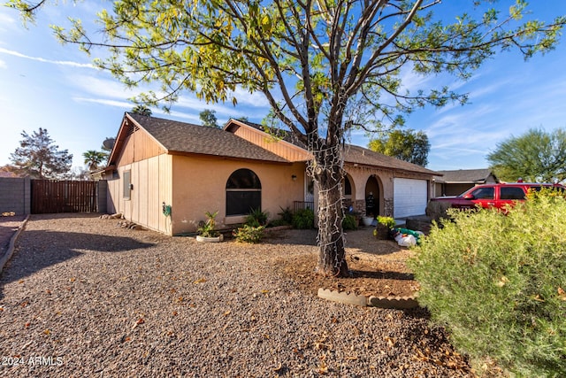 single story home with a garage