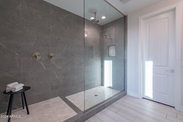 full bathroom featuring walk in shower