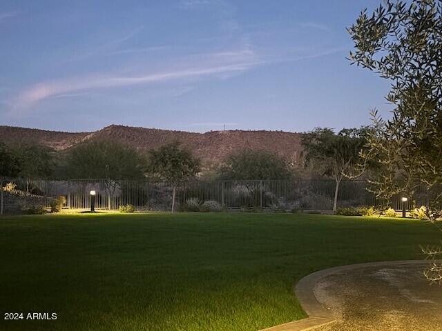 view of yard with a mountain view and fence