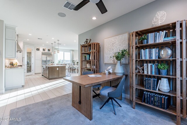 office featuring recessed lighting, visible vents, light wood-style floors, and ceiling fan