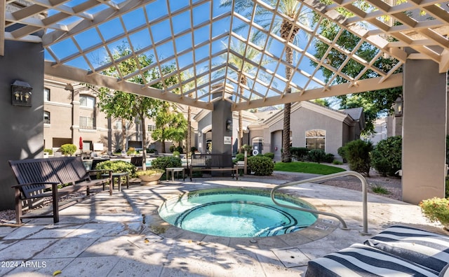 view of swimming pool with a hot tub, a patio area, and a pergola