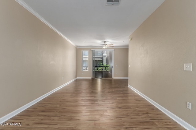 unfurnished room featuring ceiling fan and dark hardwood / wood-style floors