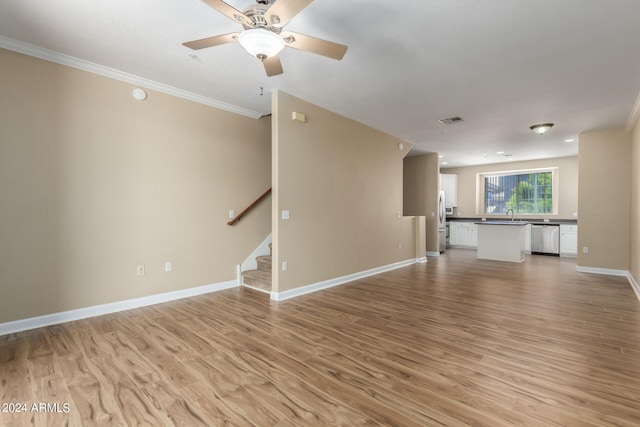 unfurnished living room featuring ornamental molding, light hardwood / wood-style floors, and ceiling fan