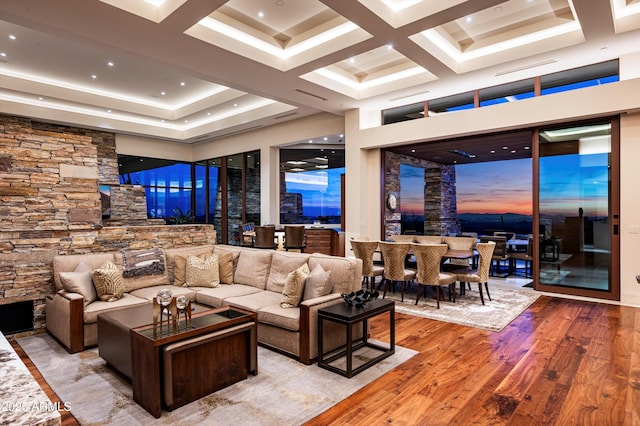 living room featuring a high ceiling and light wood-type flooring