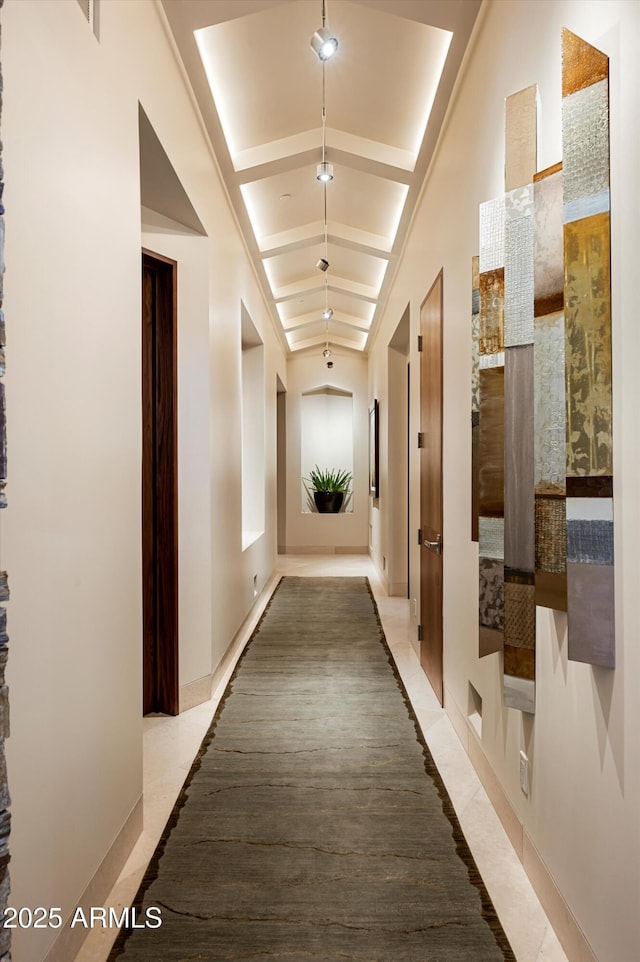 hall featuring light tile patterned floors