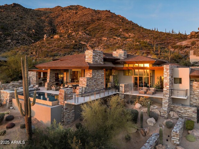 rear view of house with a mountain view