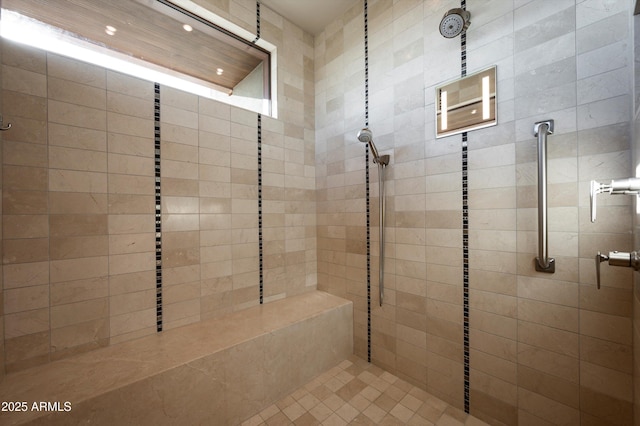 bathroom with a tile shower