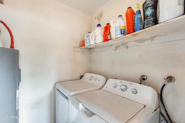 washroom featuring electric water heater and washing machine and dryer