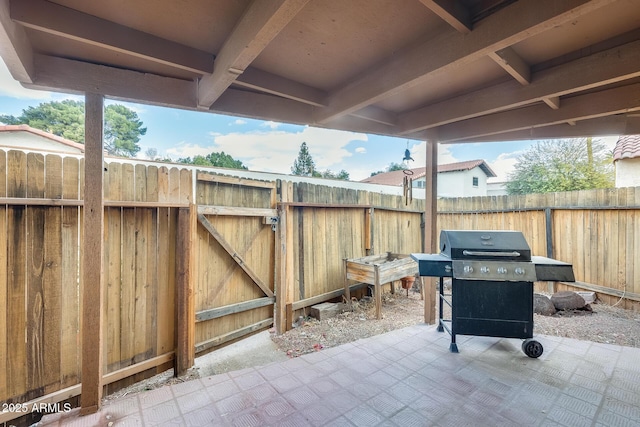 view of patio featuring a grill