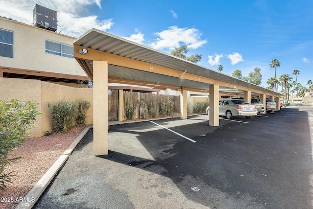 view of vehicle parking with a carport