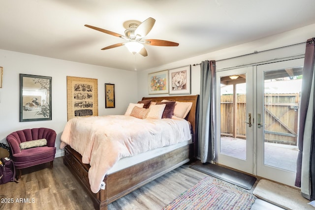 bedroom featuring french doors, dark hardwood / wood-style floors, access to exterior, and ceiling fan