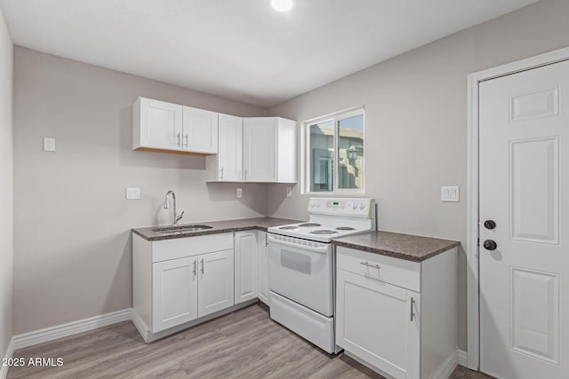 kitchen with white range with electric cooktop, light hardwood / wood-style floors, sink, and white cabinets