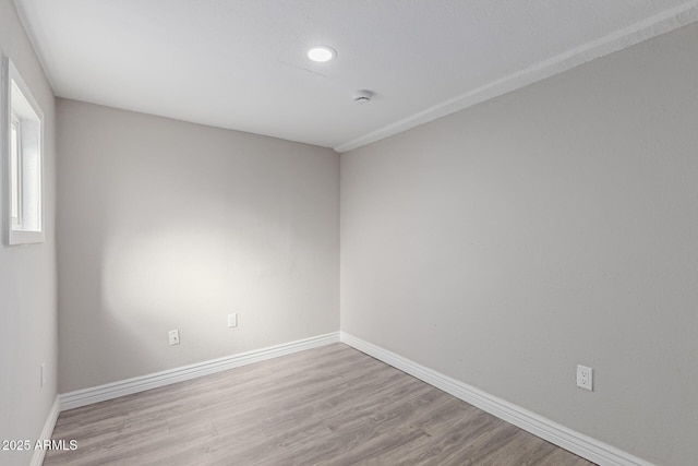 spare room with light hardwood / wood-style floors