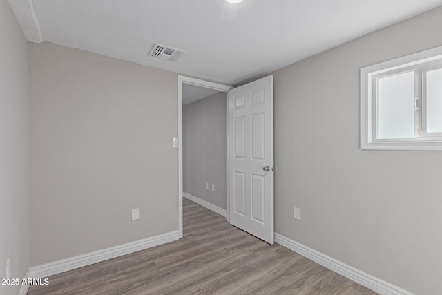 unfurnished bedroom featuring light wood-type flooring